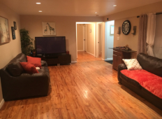 Ace Haven living room showing the door leading to the kitchen