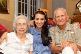 Caregiver accompanying a senior couple