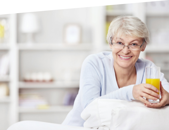 Female senior holding a glass of juice