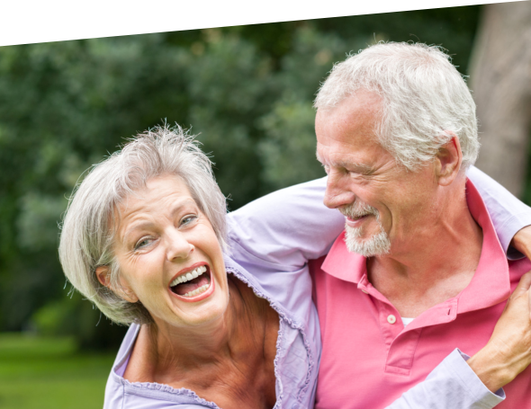Female senior laughing and her husband is watching her